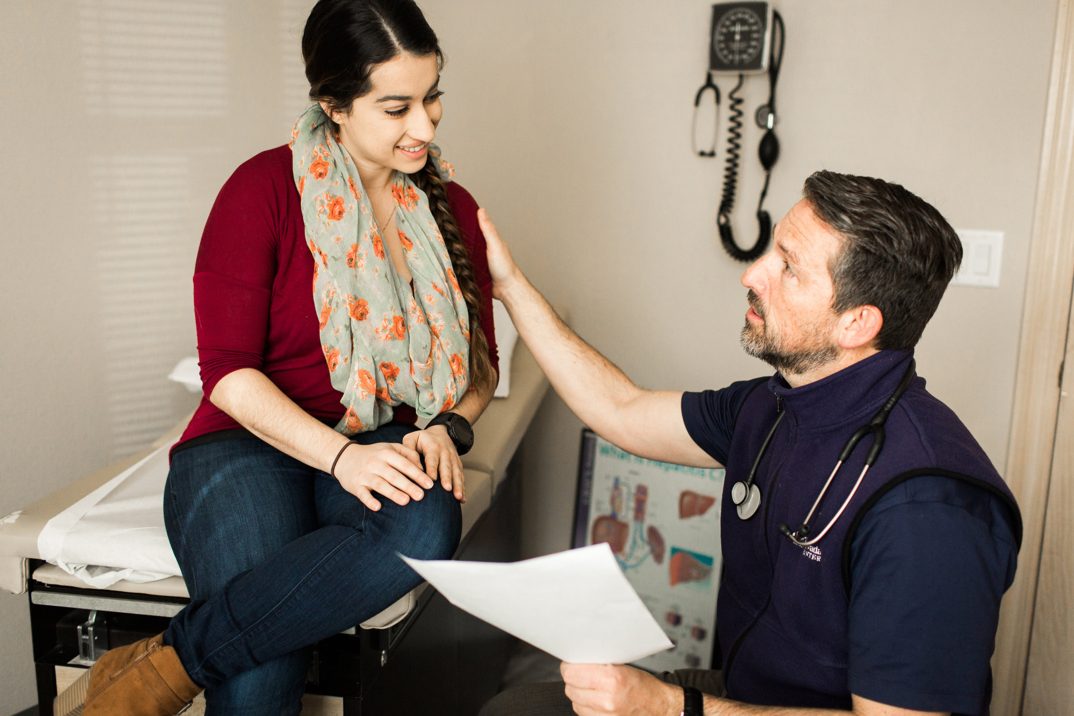 GI doctor with his patient in the examining room